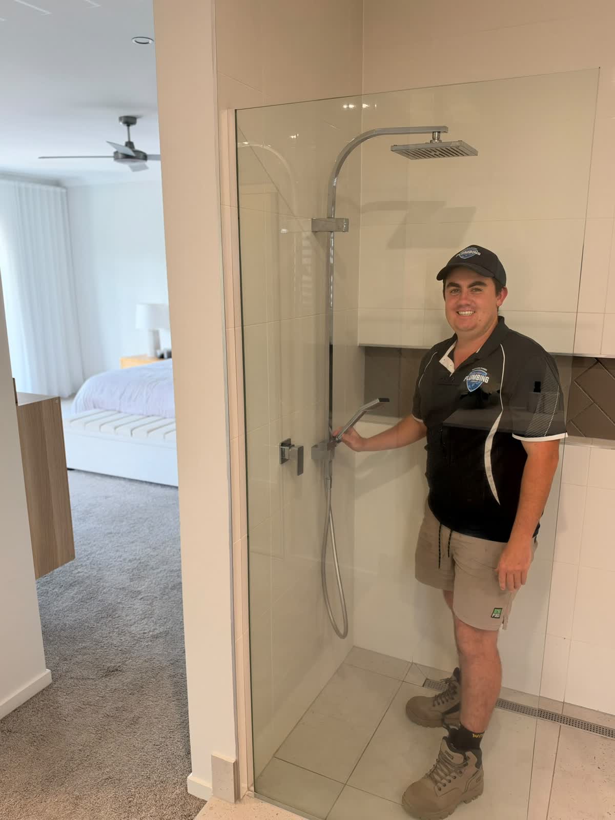 Gold Coast Plumbing plumber working on a heat pump hot water system